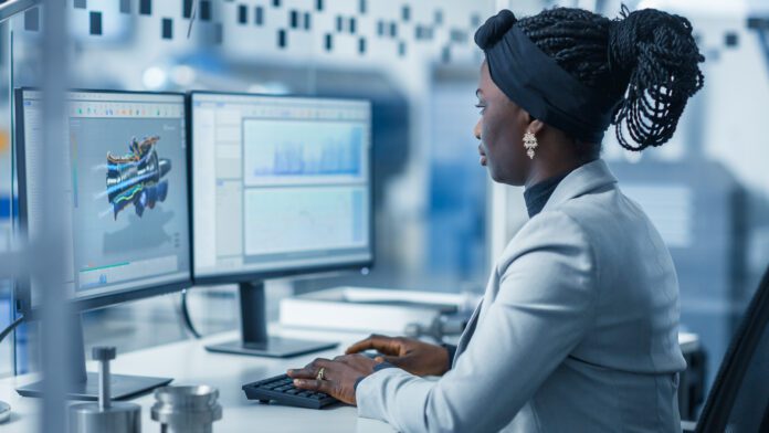 Beautiful,Female,Engineer,Working,On,Personal,Computer,In,The,High-tech