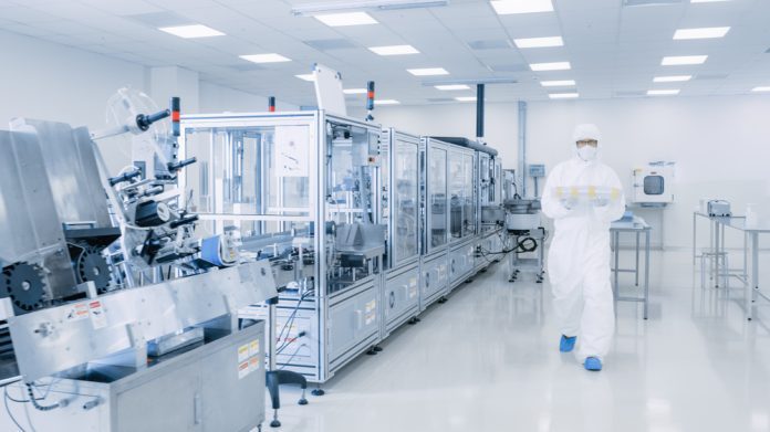 Shot,Of,Sterile,Pharmaceutical,Manufacturing,Laboratory,Where,Scientists,In,Protective