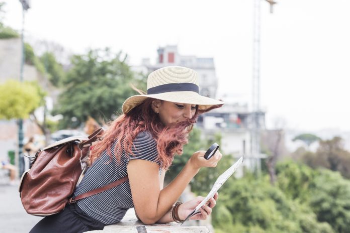 female-tourist-looking-map
