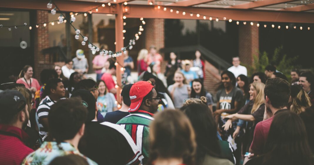 outdoor-gathering-with-string-lights-overhead