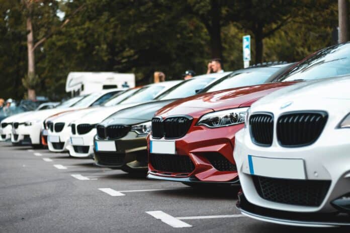 row of rental cars parked at European airport car rental lot 2026